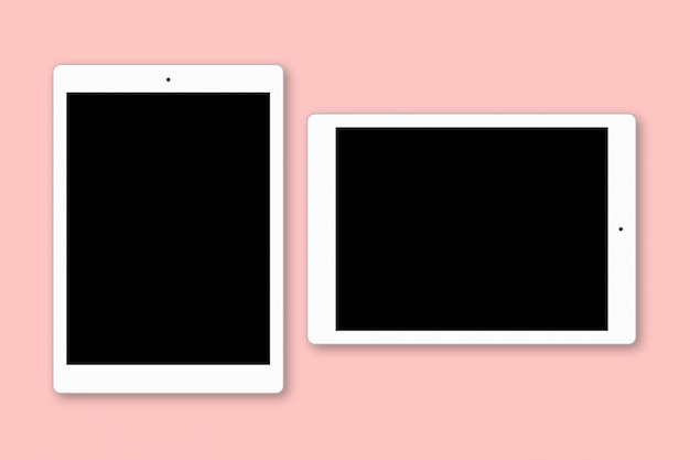 Two gadgets with black copy screens isolated over pink