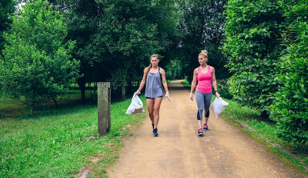 Two girls doing plogging