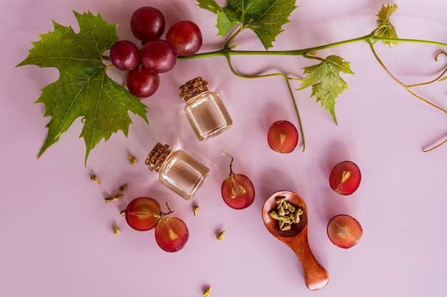 Two glass bottles with cork with natural grape seed oil a natural remedy for slowing down the aging process top view