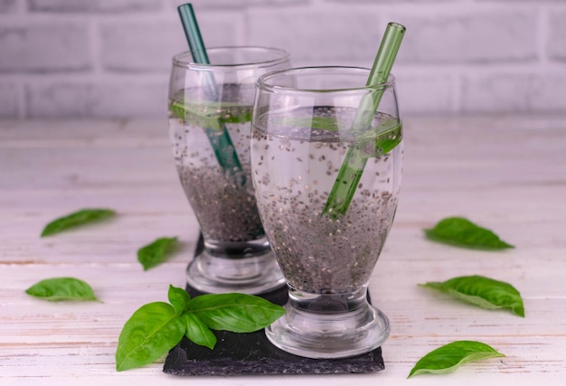 Two glasses of water with basil and chia seeds. Drink for weight loss.