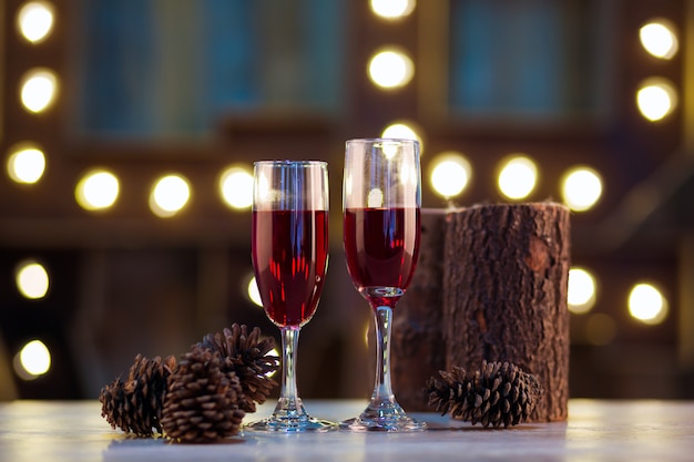 two glasses of wine on wooden background