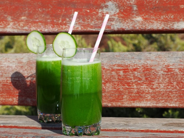 Two glasses with green smoothie