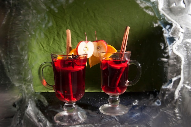 Two glasses with mulled wine on a winter background