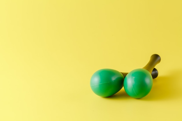 Two green maracas