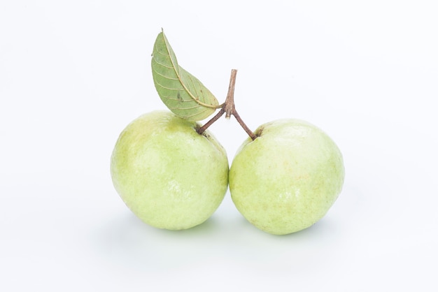 Two guava with leaf isolated on white