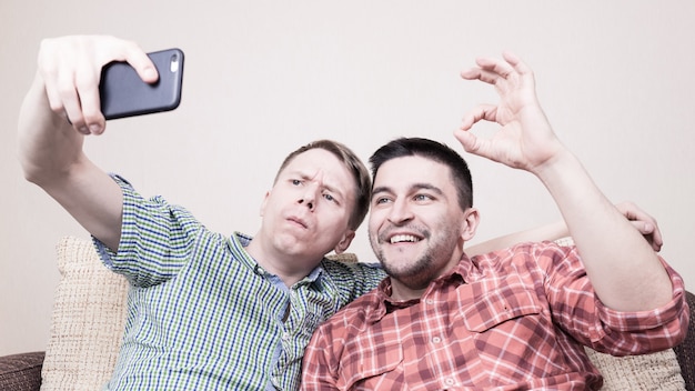 Two guys taking selfie