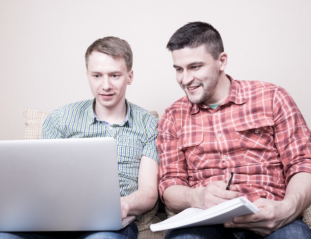 Two guys using gadgets