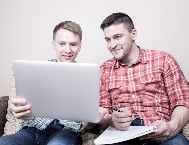 Two guys with laptop