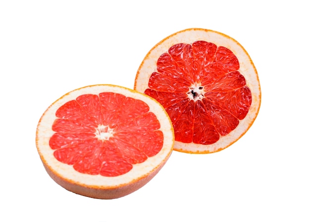 Two halves of pink grapefruit isolated on white background