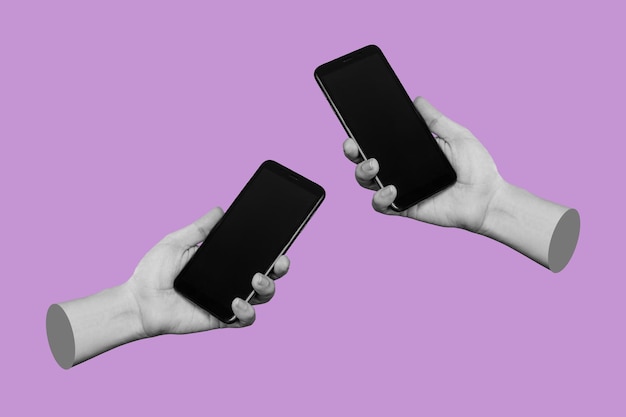 Two hands holding mobile phones with black screens empty copy space for design on lilac background