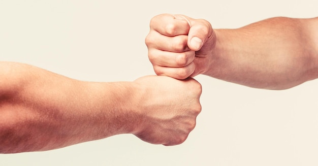 Two hands isolated arm Hands of man people fist bump team teamwork success Man giving fist bump