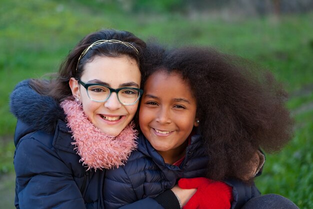 Two happy girls in the park  