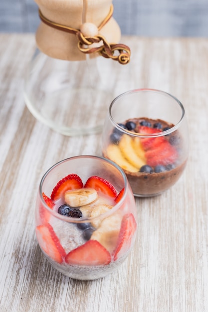 Two healthy fruit dessert on a wooden table