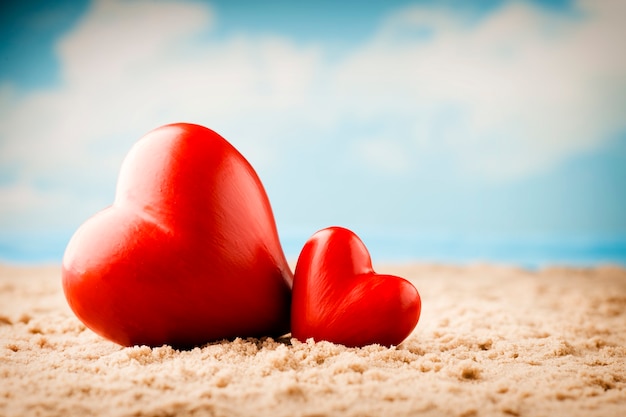 Two hearts on the beach. Honeymoon on summer