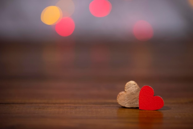 Two hearts on a wooden background with copy space Valentines day concept