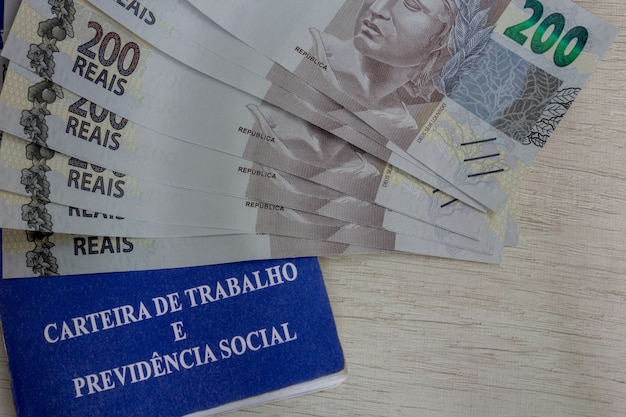 Two hundred reais bills Brazilian money and work card