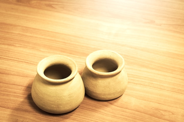 Two jar on wooden table background