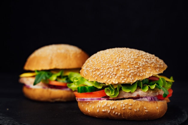 Two juicy beef burgers meal. Homemade burgers with beef and fresh vegetables