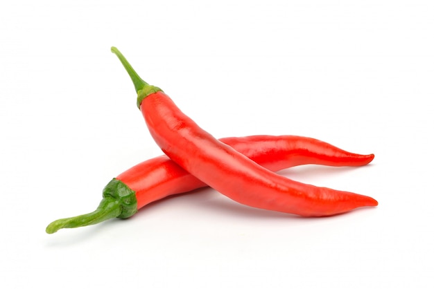 Two Large Red chili peppers isolated on white.