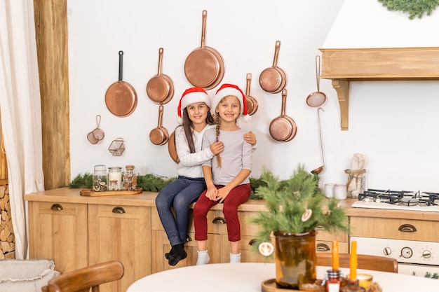 two little girls are waiting for christmas at home