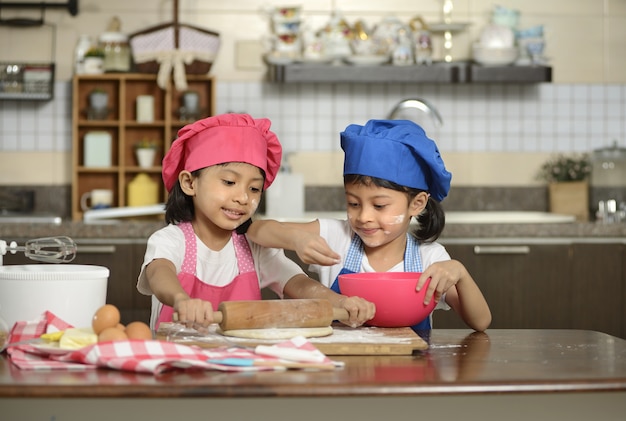 Two Little Girls Make Pizza