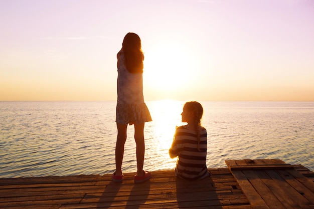 Two little girls on the pier