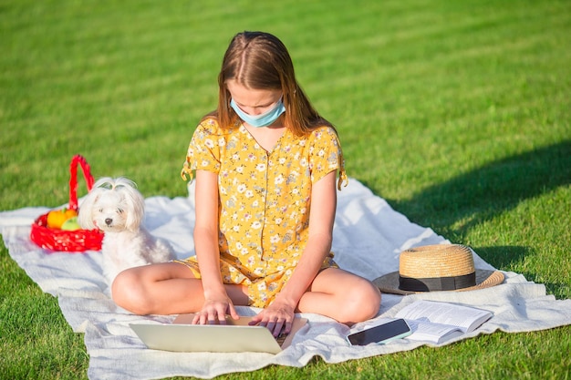 Two little kids on picnic in the park