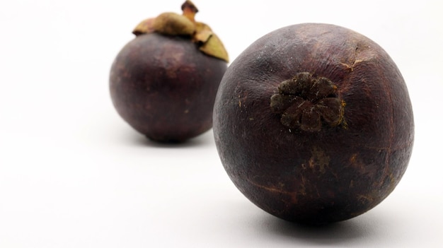 Photo two mangosteens isolated