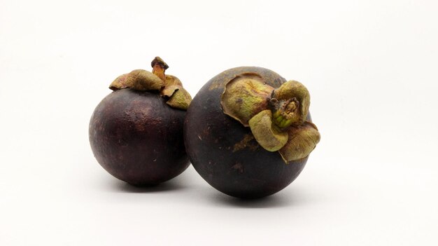 Photo two mangosteens isolated