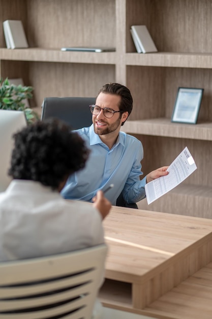 Two men in the office having a negotiations and looking involved