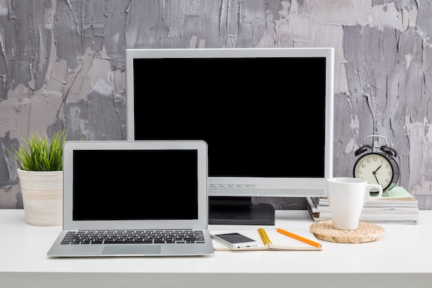 Two monitors on the desktop in a modern office