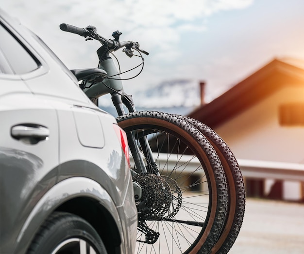 Two mountains full suspension mountain bikes on the back of SUV Concept of adventures in the mountains