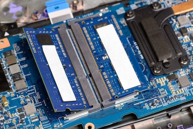 Two new RAM memory chips in the motherboard of a modern laptop