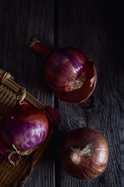 Two onions on a wooden table