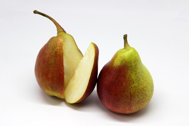 two pears one that has the other half cut off