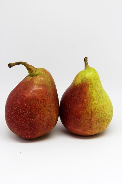 two pears one of which is red is red and green