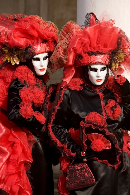 Two people in costume at the Venice Carnival