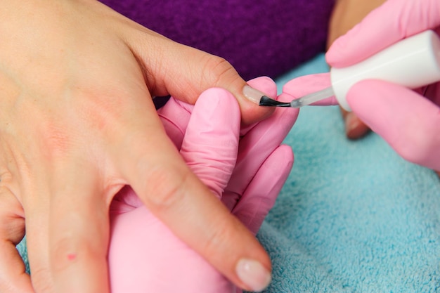 Two people holding hands for comfortHand care