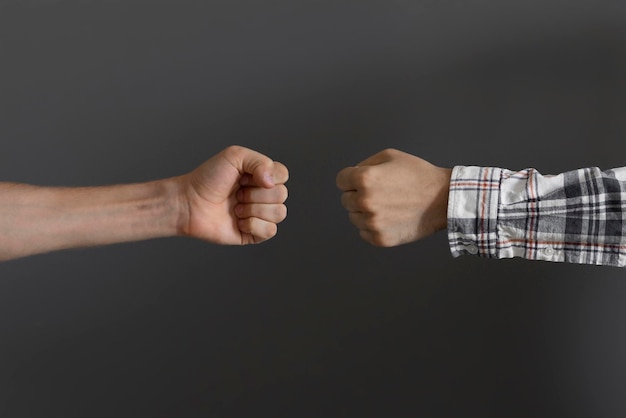 Two people make a fist bump friendship and relationship concept