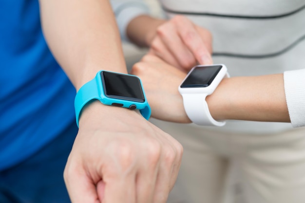 Two people using smartwatch together