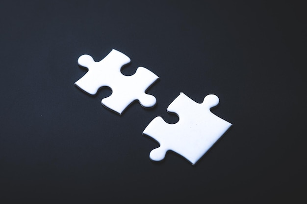 Two pieces of jigsaw use for business partner connection concept white puzzle solution teamwork in success vision concept