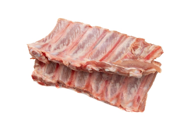 Two pieces of raw pork ribs Isolated on white background Highly demanded meat for barbecues