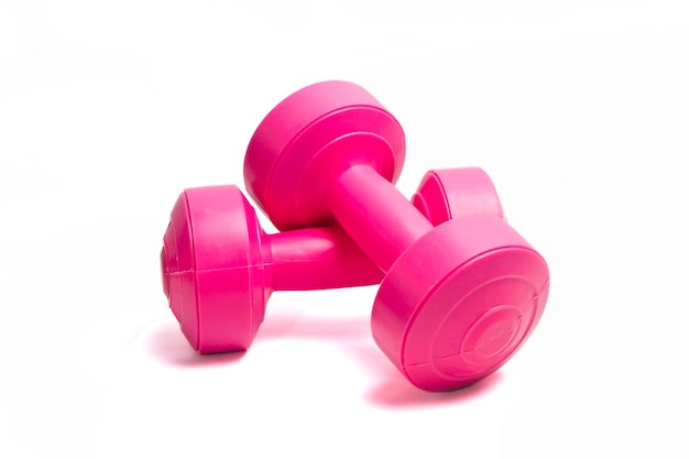 Two pink dumbbells isolated on white background