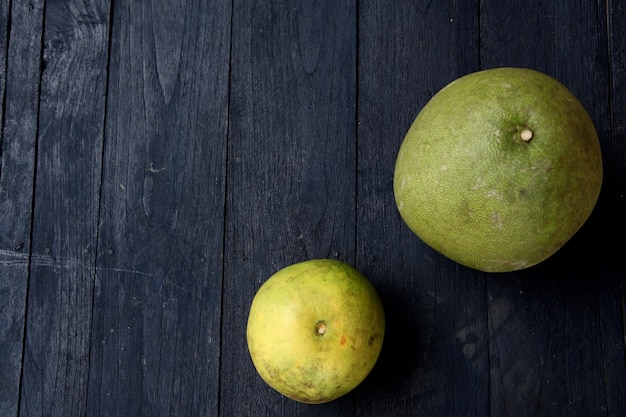 Two Pomelos on the blue board