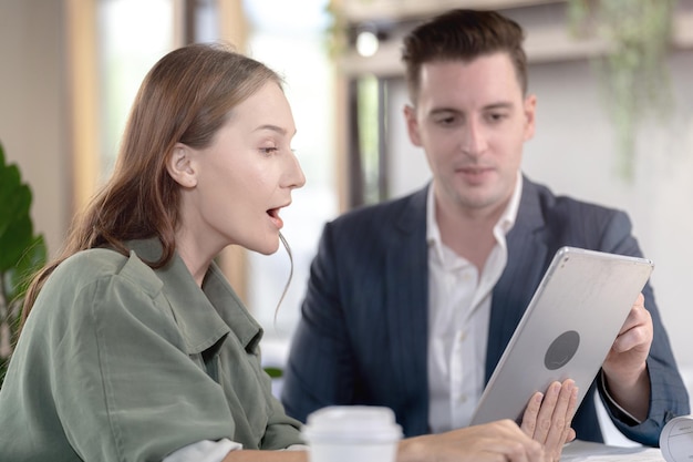 Two professional business people working together in office Indoor biophilia and nature trees environment