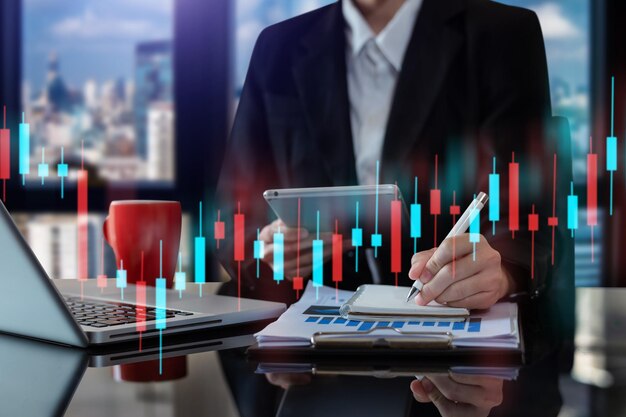 Two professional traides on technical price graph and indicator red and green candlestick chart and stock trading computer