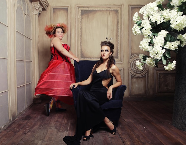 Two queens in carnaval dress Black and red