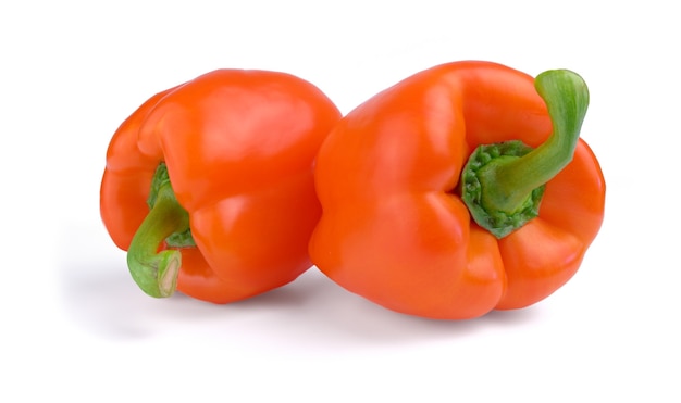 Two red sweet peppers isolated