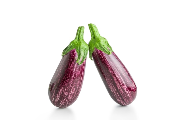 Two ripe graffiti eggplants isolated on a white background Food concept