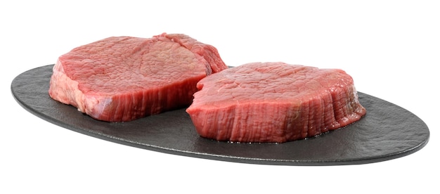 Two round raw beef steak on a black oval cutting board white isolated background